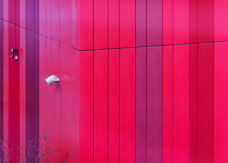 Video surveillance system on the facade of a modern building. Bright wall panels and security...