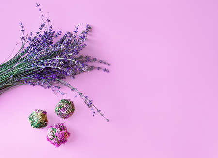 Nature spring composition of dried lavender flowers and flower balls on a pink background with copy spaceの写真素材