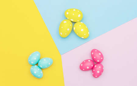 Bright colored easter eggs on a colorful backgroundの写真素材
