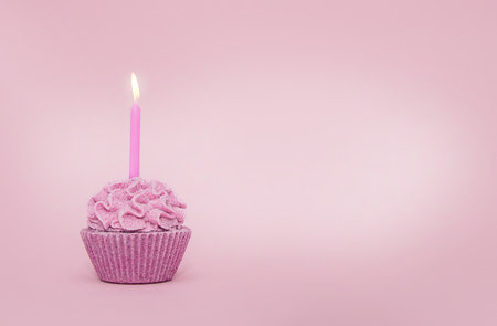 Cupcake with a candle for a holidayの写真素材