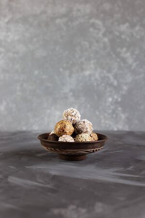 Energy protein balls on a gray background. Healthy, nutritious snack. Horizontal photo with copy space.の写真素材