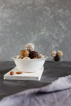 Energy protein balls on a gray background. Healthy, nutritious snack. Horizontal photo with copy space.の写真素材