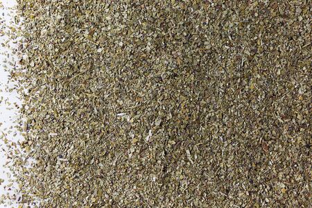 Background of green, natural, healthy mate tea scattered on the table. Copy space.の写真素材