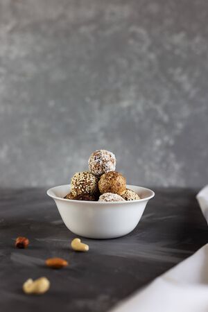 Energy protein balls on a gray background. Healthy, nutritious snack. Horizontal photo with copy space.の写真素材