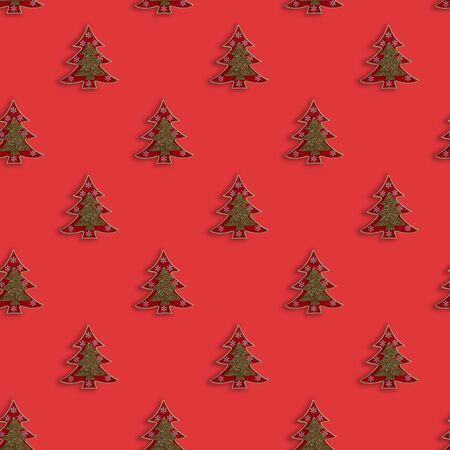 Christmas pattern with decorative Christmas tree on red background. Top view. Xmas composition. New Year. Flat lay.の写真素材