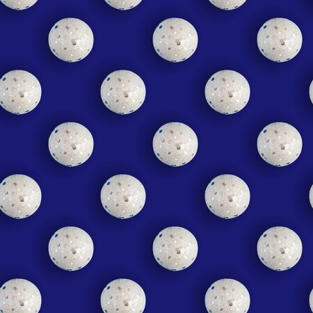 Seamless Christmas pattern with shiny white balls on blue background. Flat lay.の写真素材