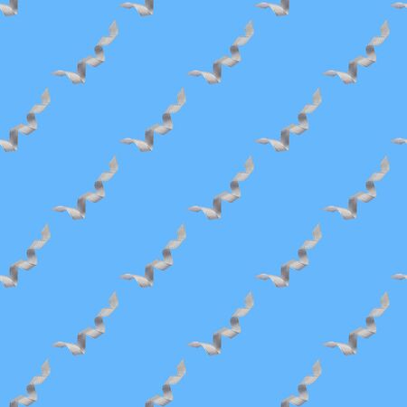 Seamless pattern with white ribbon on blue background. Flat lay.の写真素材