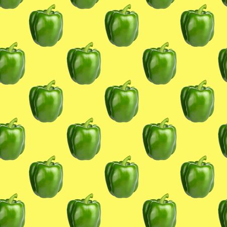 Seamless food pattern. Green sweet bell pepper on a yellow background. Vegetable, healthy ingredient. Bulgarian paprikaの写真素材