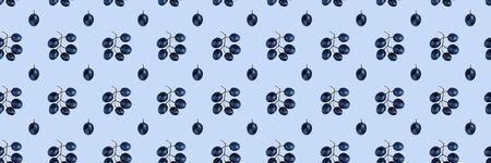 Seamless pattern of grapes isolated on blue. Food background. Flat lay.の写真素材