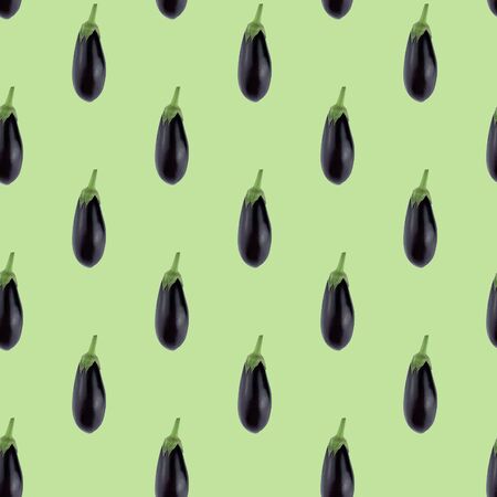 Seamless pattern of eggplant on a green background. Minimal concept, isometric food texture.の写真素材
