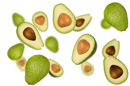 Flying fruits. Falling avocado isolated on a white background with clipping path as package design element and advertising.の写真素材