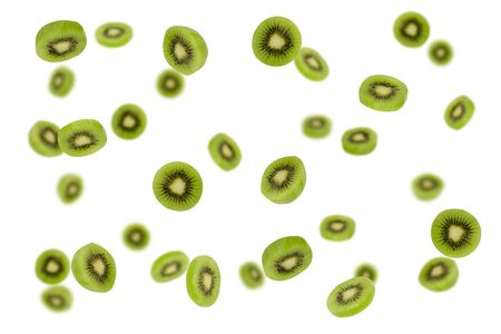 Falling kiwi slices isolated on a white background as package design element and advertising. Flying food. Floating fruits in the air. Top viewの写真素材