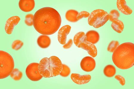 Falling tangerines isolated on a colored background  as package design element and advertising. Flying food. Floating fruits in the air. Top viewの写真素材