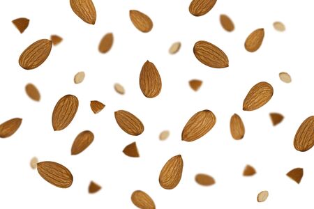 Falling almonds isolated on a white background    as package design element and advertising. Flying food. Top view.の写真素材