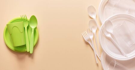 A set of reusable plastic dishes vs disposable ones on a beige table. Save environment concept. Zero waste.の写真素材