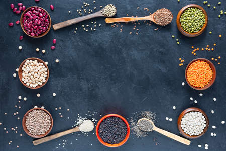 Legumes, seeds and cereals on a dark background. Healthy food. Top view, copy of space.の写真素材