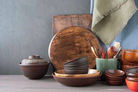 Clay and wooden dishes on the table. Eco friendly