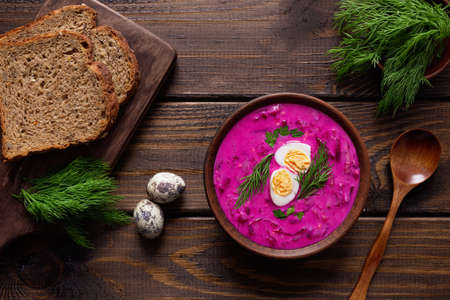Delicious, healthy cold beetroot soup with cucumber, made with kefir decorated with egg and dill. Easy recipe, vegetarian healthy food. Top viewの写真素材