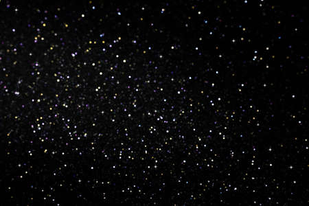 Dark abstract background with bokeh lights and starsの写真素材