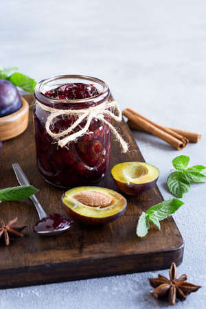 Plum jam and ingredients for its preparation: plums, cinnamon, star anise and mint. Homemade marmalade for a delicious breakfastの写真素材