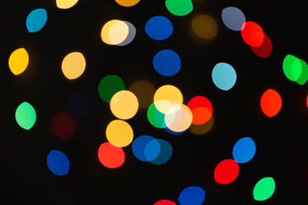 Background of colored bokeh. Multi-colored bright blurred texture of lights.の写真素材
