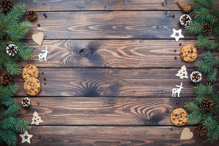 Christmas background with Chocolate chip cookies and wooden decorations, flat lay, top view. New year card. Zero waste Xmas, eco friendly.の写真素材