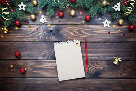 Wishlist, checklist, to do list activity for New Year on a wooden table. Xmas card. Christmas invitation. Top view. Flat layの写真素材