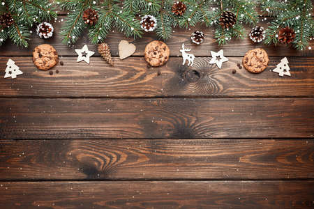 Christmas background with Chocolate chip cookies and wooden decorations. Eco friendly, zero waste. New years backdropの写真素材