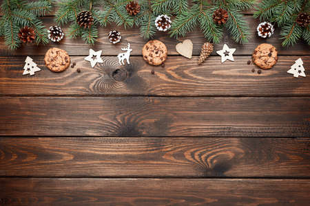 Christmas background with Chocolate chip cookies and wooden decorations. Eco friendly, zero waste. New years backdropの写真素材