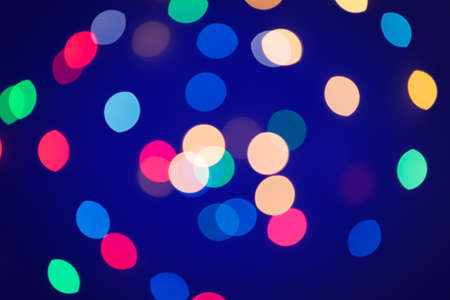 Background of colored bokeh. Multi-colored bright blurred texture of lightsの写真素材