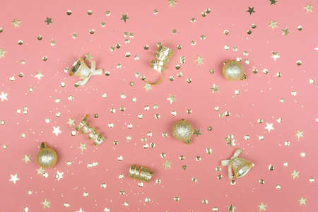 Colored background with glitter, golden stars and decorations. Sparkling texture. Festive backdrop for your projectsの写真素材