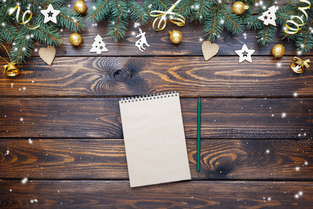 Wishlist, checklist, to do list activity for New Year on a wooden table. Xmas card. Christmas invitation. Top view.の写真素材