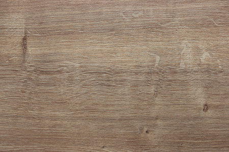 Wooden table surface, brown wood texture. Light natural background, top view.の写真素材