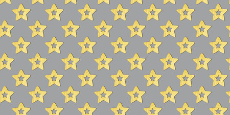 Seamless Christmas pattern with wooden decorative yellow stars on a gray background. Trendy colors 2021. Xmas abstract backdrop. Top view.の写真素材