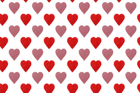 Seamless pattern of pink and red hearts on a white background. fabric design, wallpaper, packaging.の写真素材