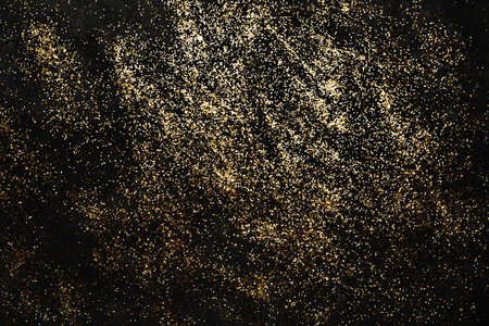 Black Holiday Abstract Background With gold confetti. Sparkling texture. Festive backdrop for your projectsの写真素材
