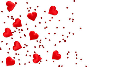 Red romantic hearts on a white background with copy space. Valentine's day texture. Love concept. Top view. Bannerの写真素材