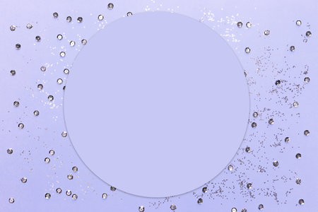 Lilac background with silver sequins and shining paillettes with copy space. Greeting card. Mock upの写真素材