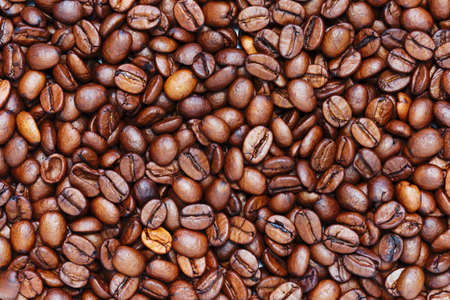 Background of roasted coffee beans. The texture of the coffeeの写真素材