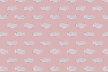 Seamless pattern. White cream textures on a pink background. Smears of cosmetic skin care products. wellness and beauty concept.の写真素材