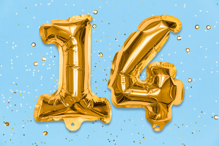 The number of the balloon made of golden foil, the number fourteen on a blue background with sequins. Birthday greeting card with inscription 14. Numerical digit, Celebration event, template.の写真素材