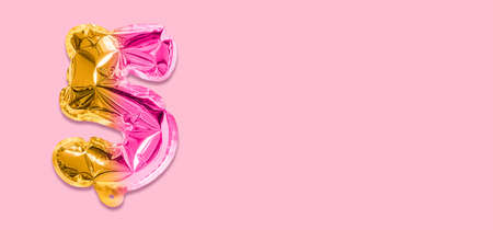Rainbow foil balloon number, digit five on a pink background. Birthday greeting card with inscription 5. Anniversary concept. top view. Numerical digit. Celebration event template. Banner.の写真素材