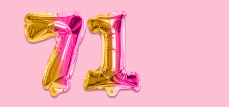 Rainbow foil balloon number, digit seventy one on a pink background. Birthday greeting card with inscription 71. Top view. Numerical digit. Celebration event template. Banner.の写真素材