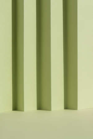 Abstract green background for the presentation of a cosmetic product. A scene with a geometric background. Podium for product promotion, beauty, natural eco cosmetic. Showcase, display case.の写真素材