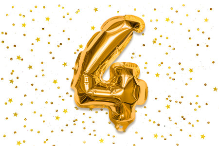 The number of the balloon made of golden foil, the number four on a white background with sequins. Birthday greeting card with inscription 4. Numerical digit, Celebration event, template.の写真素材