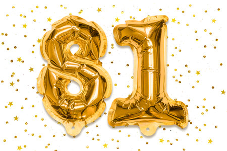 The number of the balloon made of golden foil, the number eighty-one on a white background with sequins. Birthday greeting card with inscription 81. Numerical digit, Celebration event.の写真素材