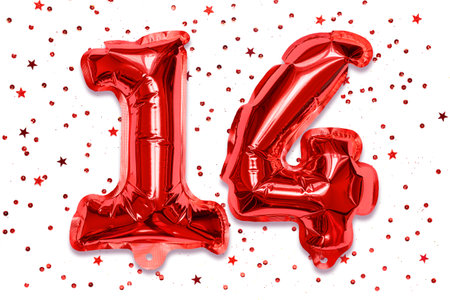 The number of the balloon made of red foil, the number fourteen on a white background with sequins. Birthday greeting card with inscription 14. Numerical digit, Celebration event.の写真素材