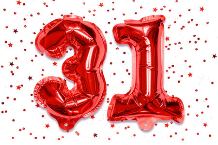 The number of the balloon made of red foil, the number thirty-one on a white background with sequins. Birthday greeting card with inscription 31. Numerical digit, Celebration event.の写真素材