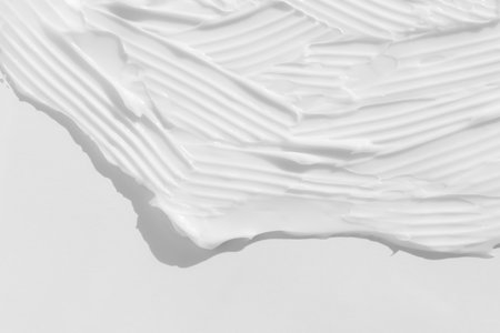 The texture of the white cream. cosmetic background. Smears of body care cosmetics on a white background. wellness and beauty concept.の写真素材