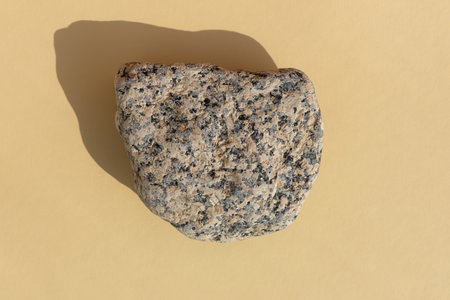 Abstract empty podium made of multicolored stone on a beige background. Showcase for product promotion, beauty, natural eco cosmetic. top view.の写真素材
